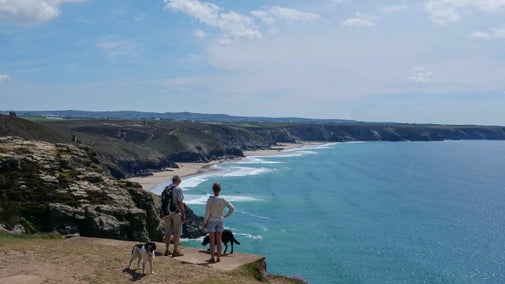 Walkers stopping to take in the view, Chapel Porth, Cornwall